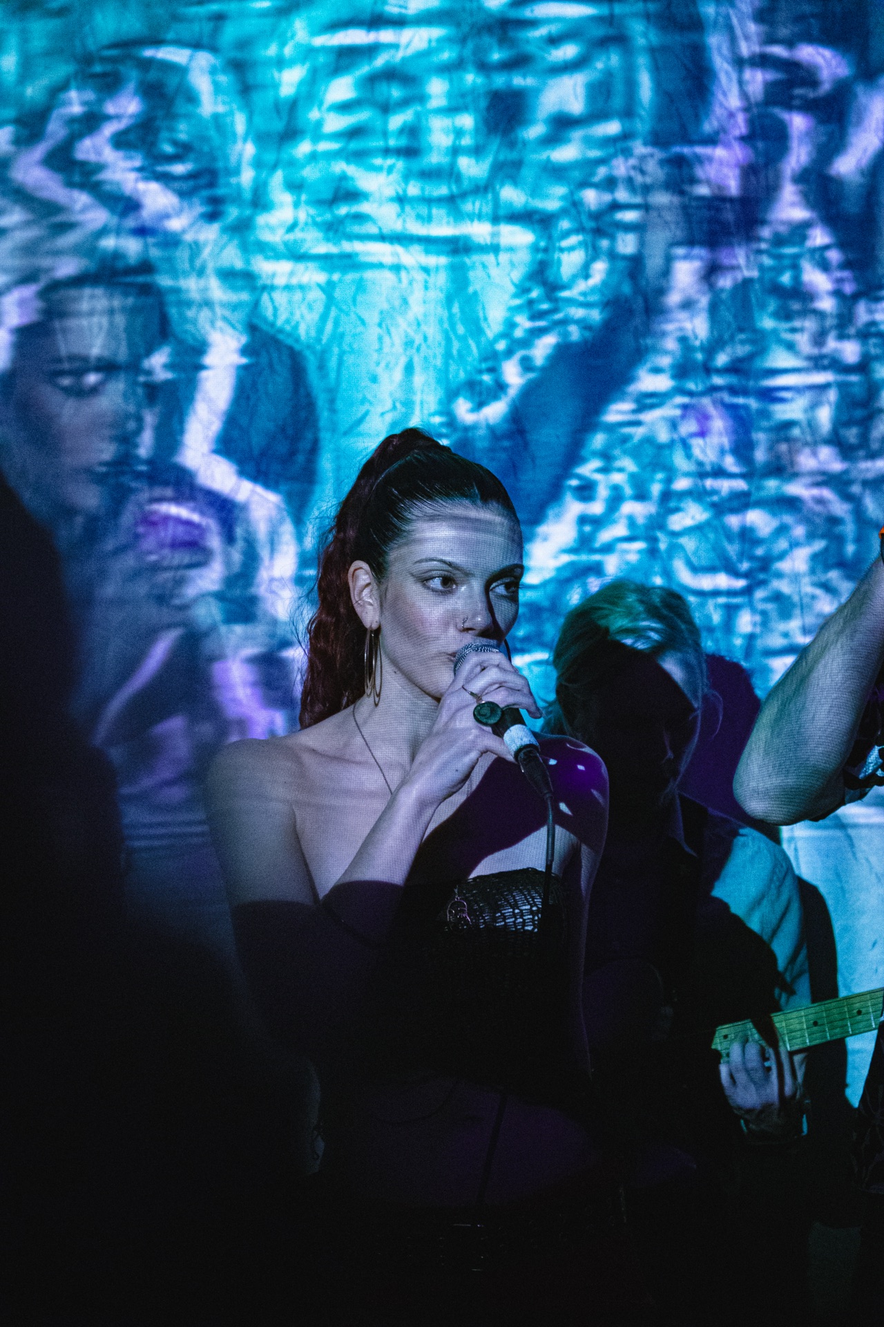 Loulia with the crowd in blue light