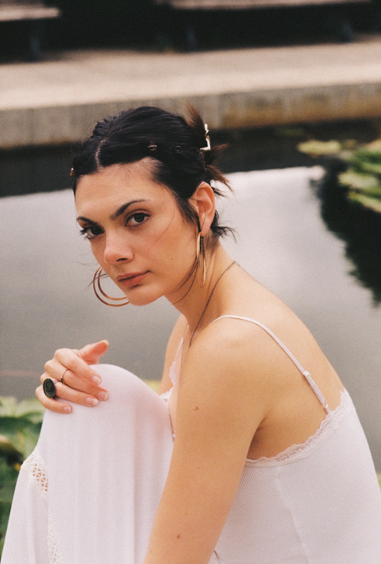 Loulia in a white off-shoulder top