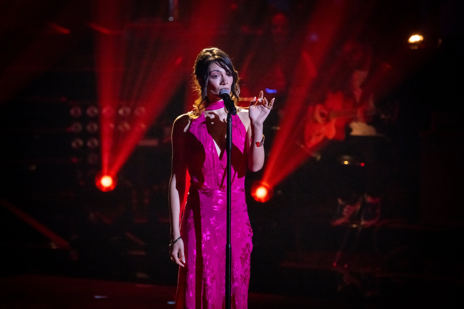 Loulia performing in a red gown